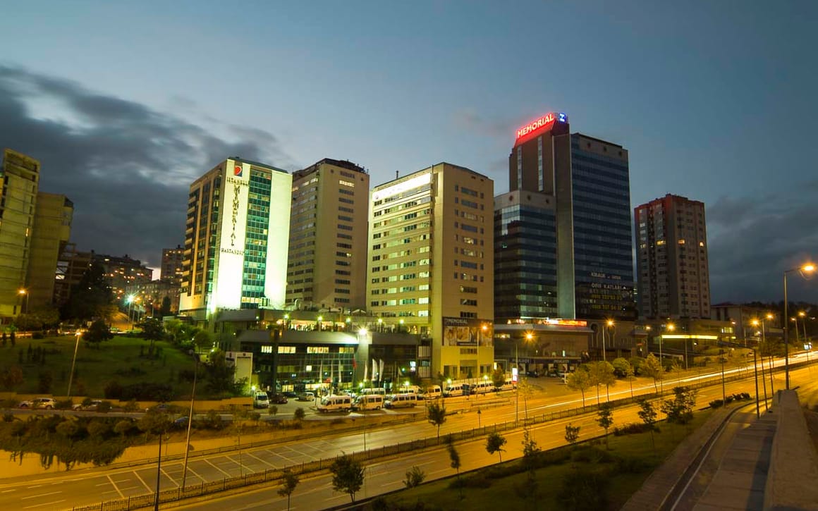 Memorial Şişli Hospital in the Okmeydanı district of Istanbul, photographed at dusk with its illuminated signage.