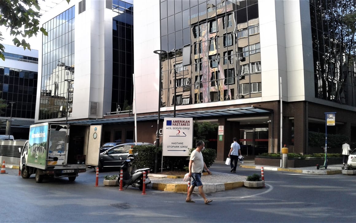 The entrance and forecourt of the VKF American Hospital in Nişantaşı, Istanbul, with its signage above the driveway.